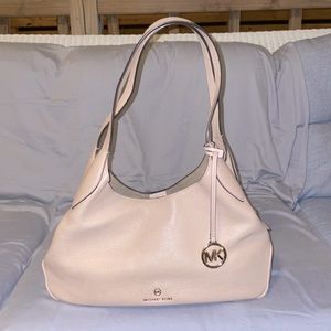 NWOT. Lightly used. Light blush cream color. Shoulder bag.